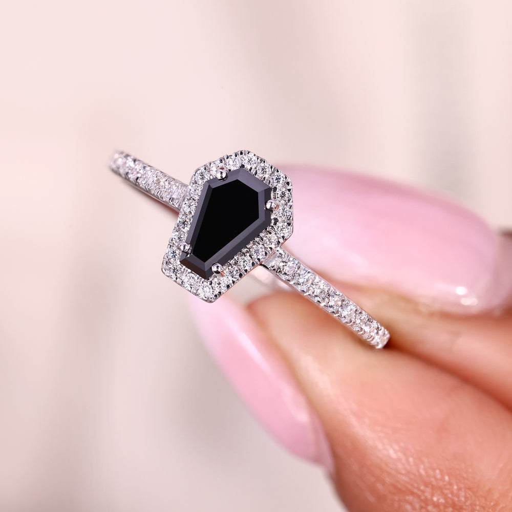 Coffin cut ring with cathedral and four prong setting.