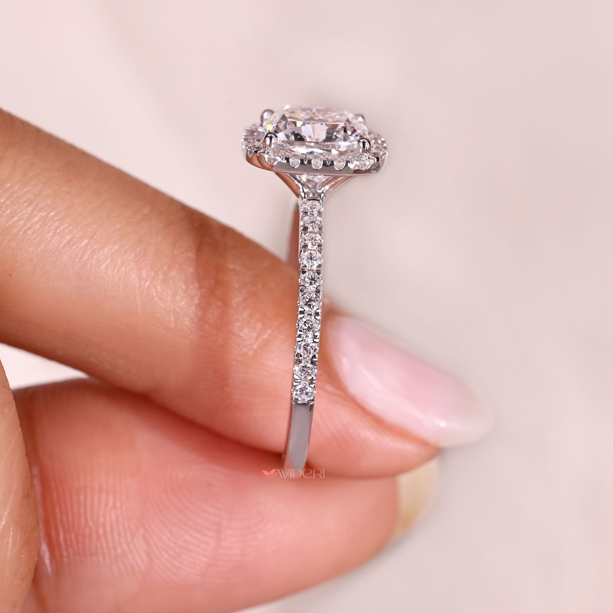Lab grown cushion cut diamond halo ring.
