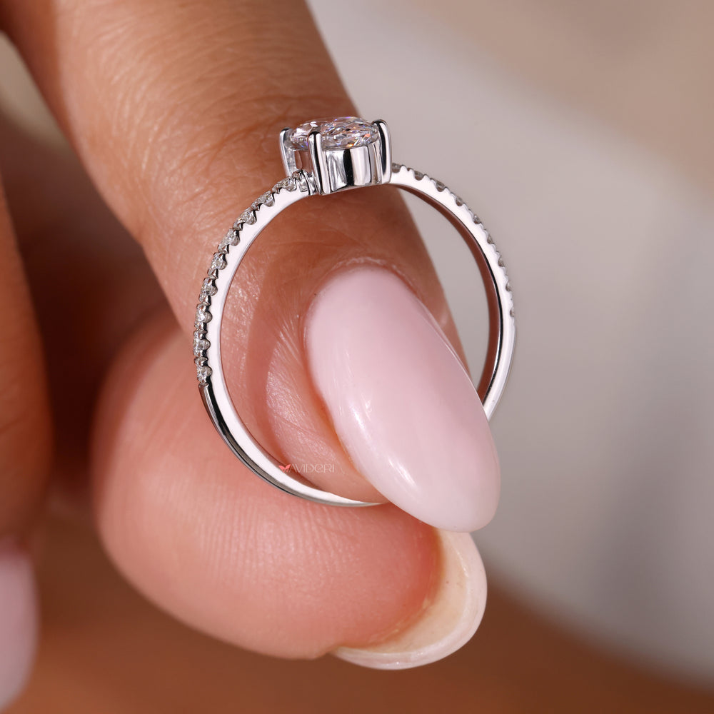 White gold ring featuring a beautiful oval shaped engagement ring design.
