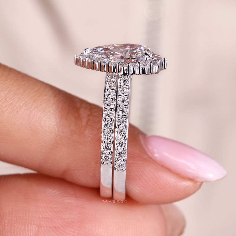 Pave setting pear diamond ring in white gold.
