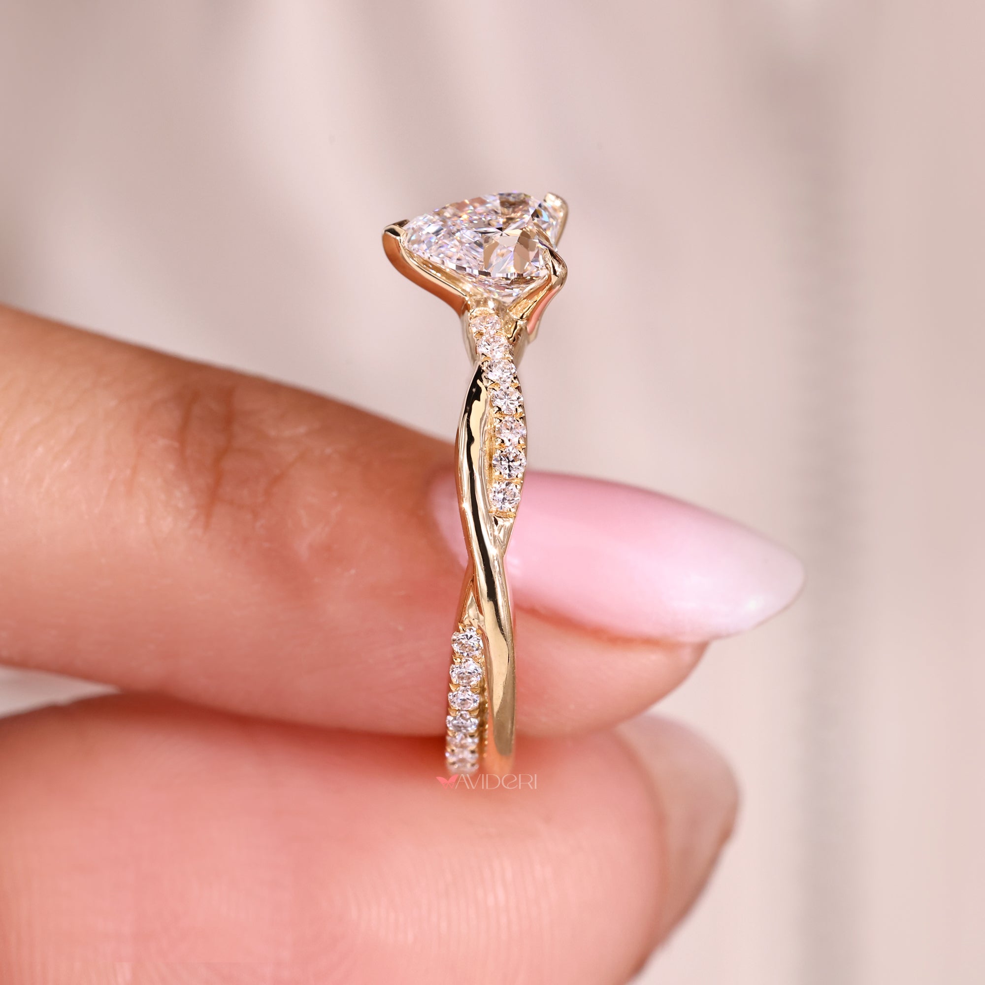Twisted pave engagement ring with heart diamond.