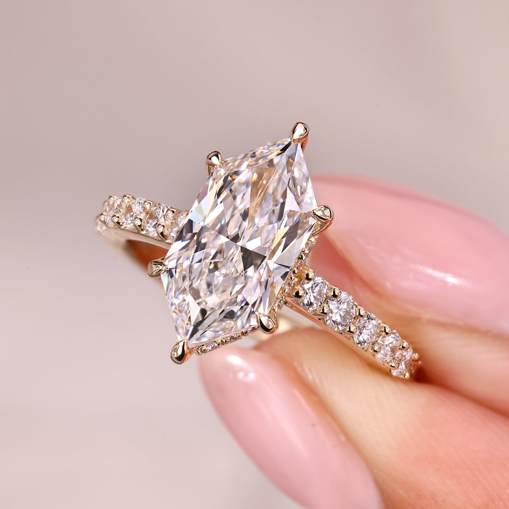 Hidden halo engagement ring with dutch marquise ring.