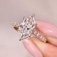 Hidden halo engagement ring with dutch marquise ring.