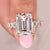 Emerald cut ring with emerald pave band and four prongs.
