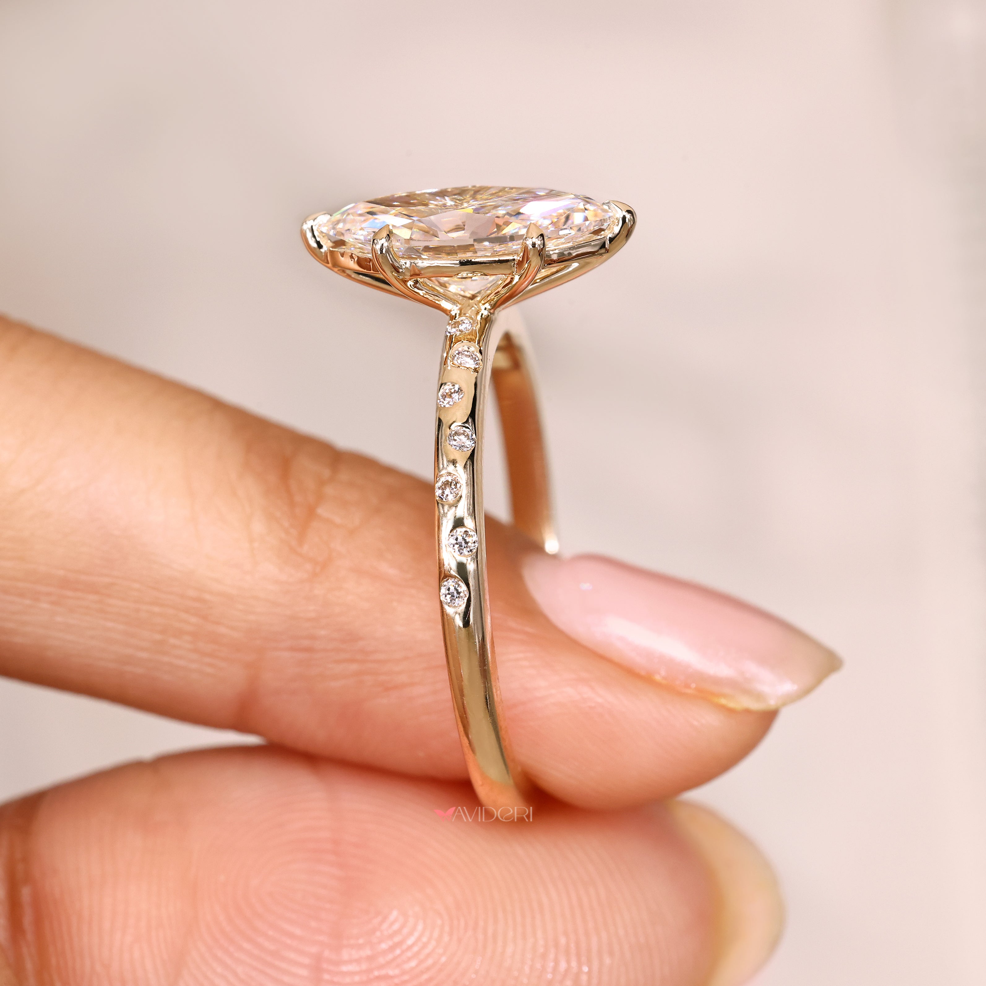 Marquise diamond ring with claw prong setting.

