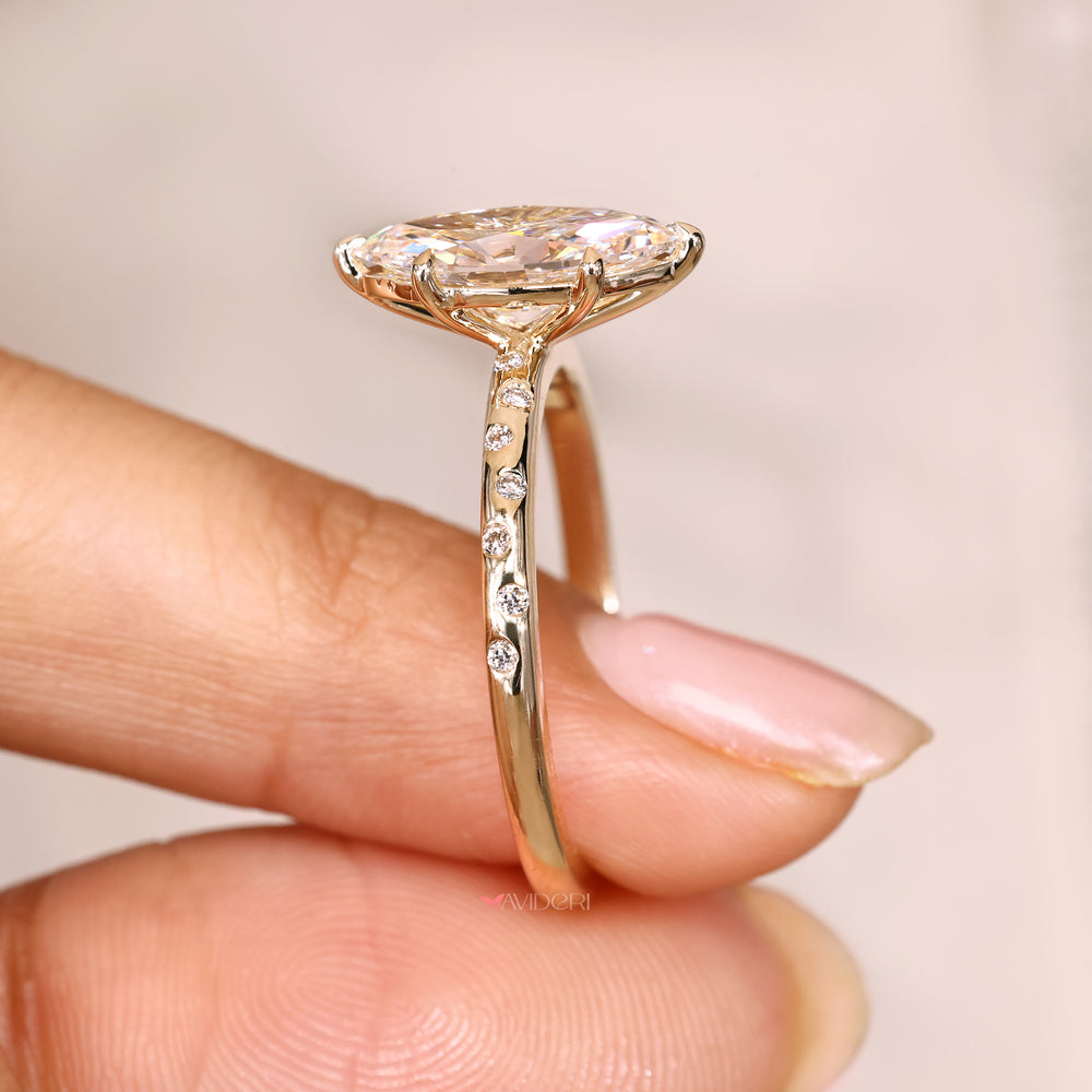Marquise diamond ring with claw prong setting.
