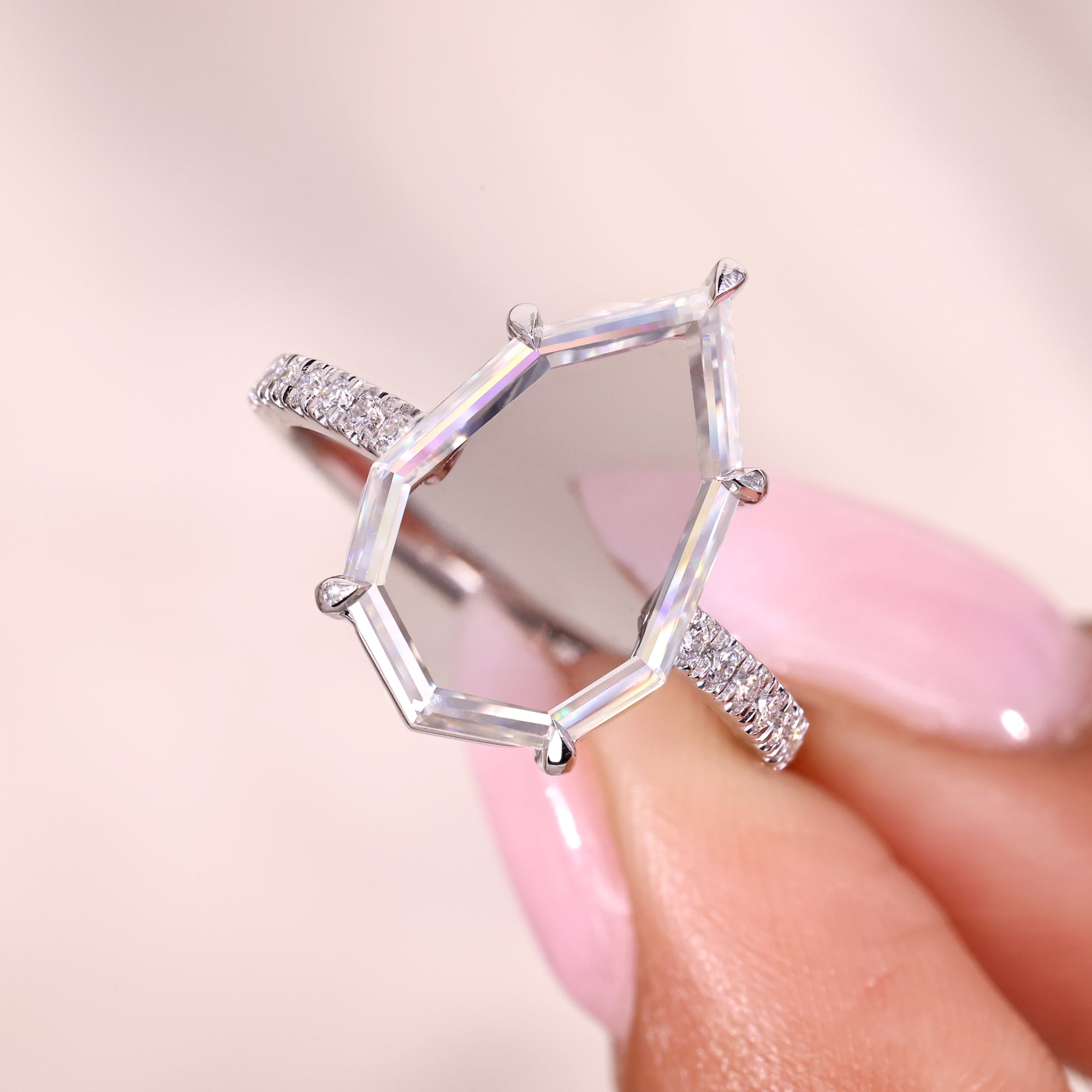 Classic round cut ring with a sparkling moissanite stone.
