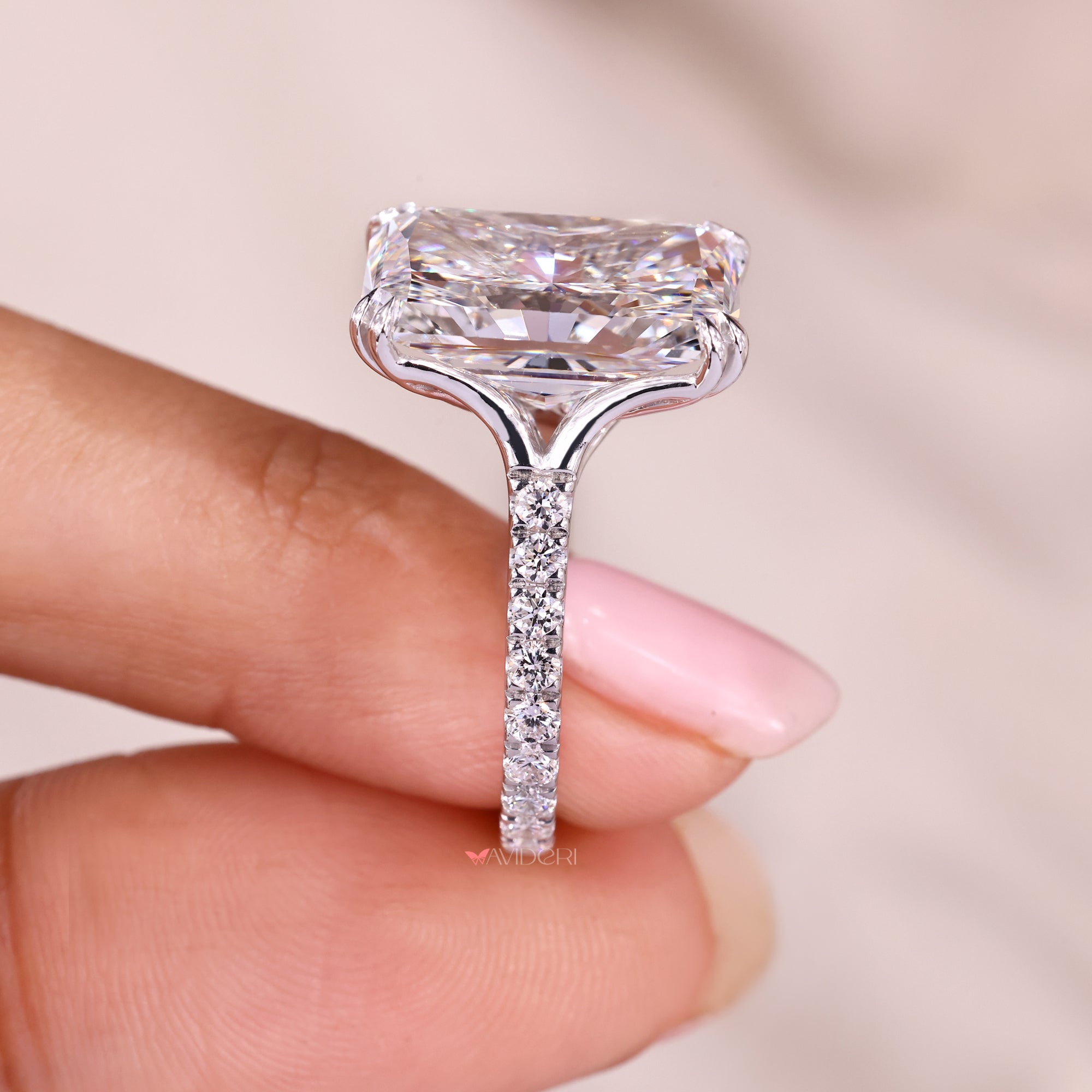 Double claw prong setting ring holding the center diamond securely.