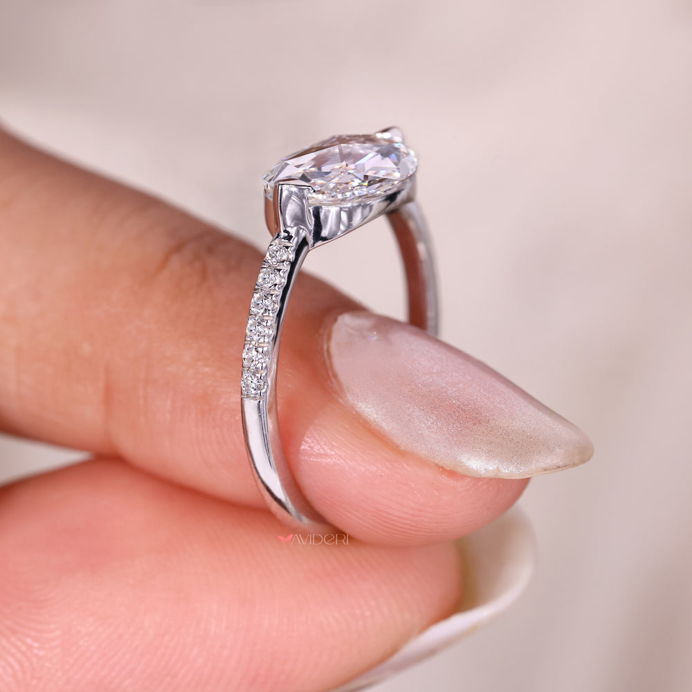 Pave setting ring featuring round cut diamond accents.