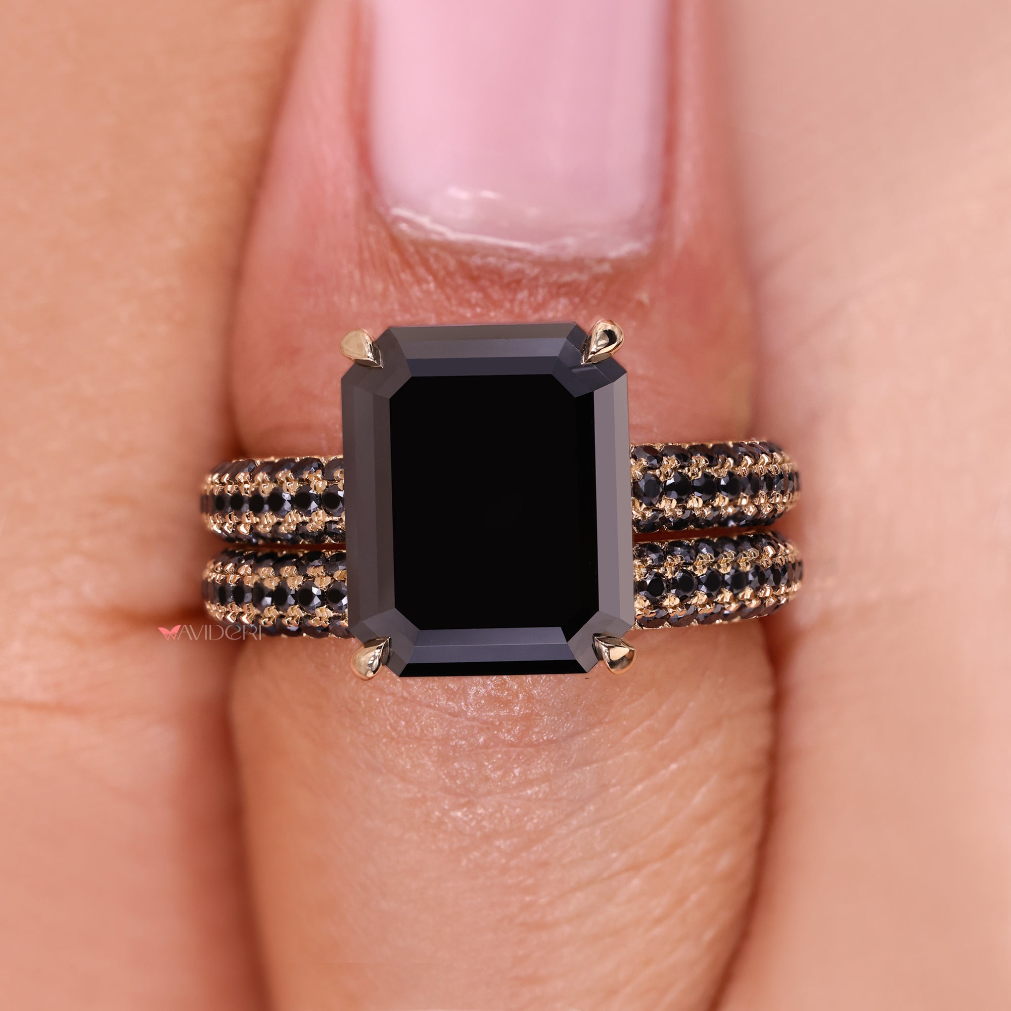 Handmade bridal set featuring an emerald cut moissanite ring for a personalized touch.