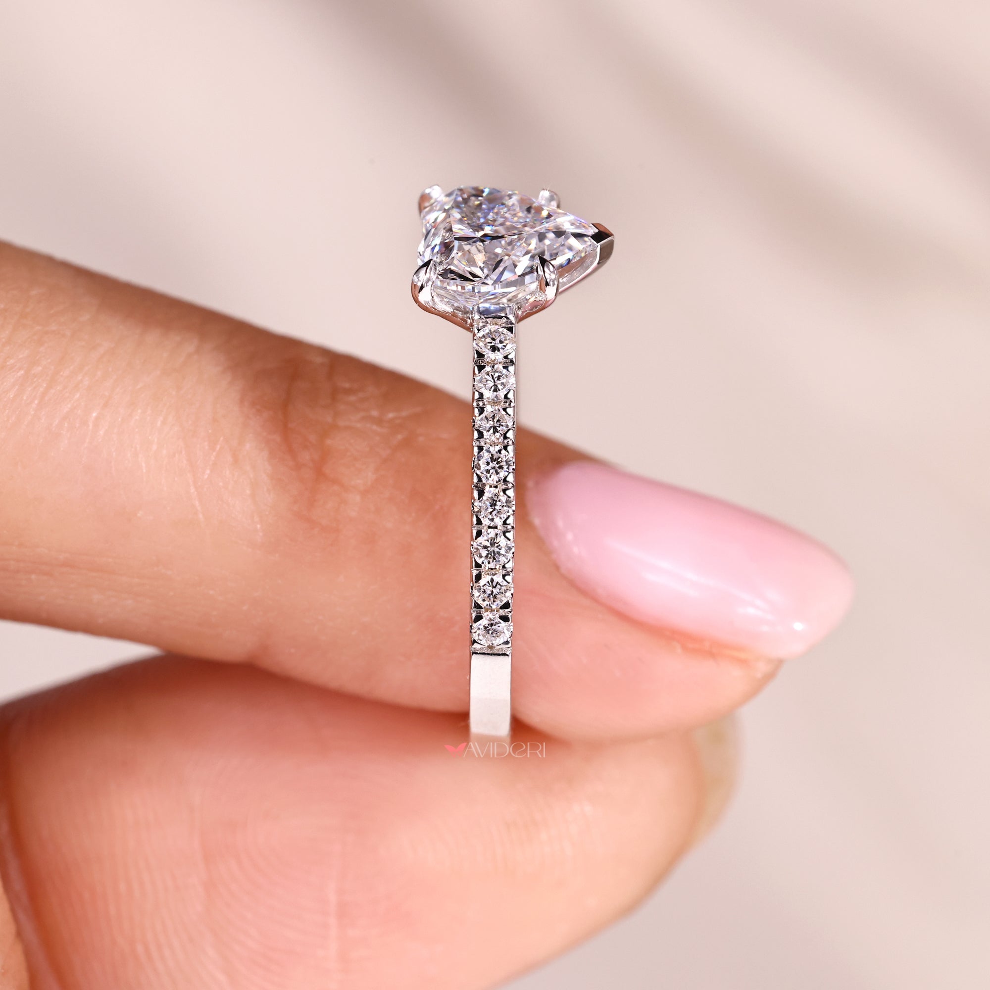 Round cut pave setting with white gold engagement ring.