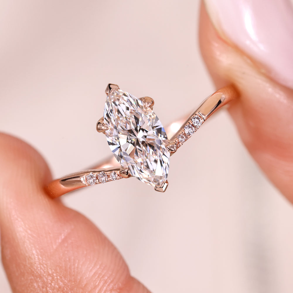 Lab grown marquise diamond ring with sleek taper.

