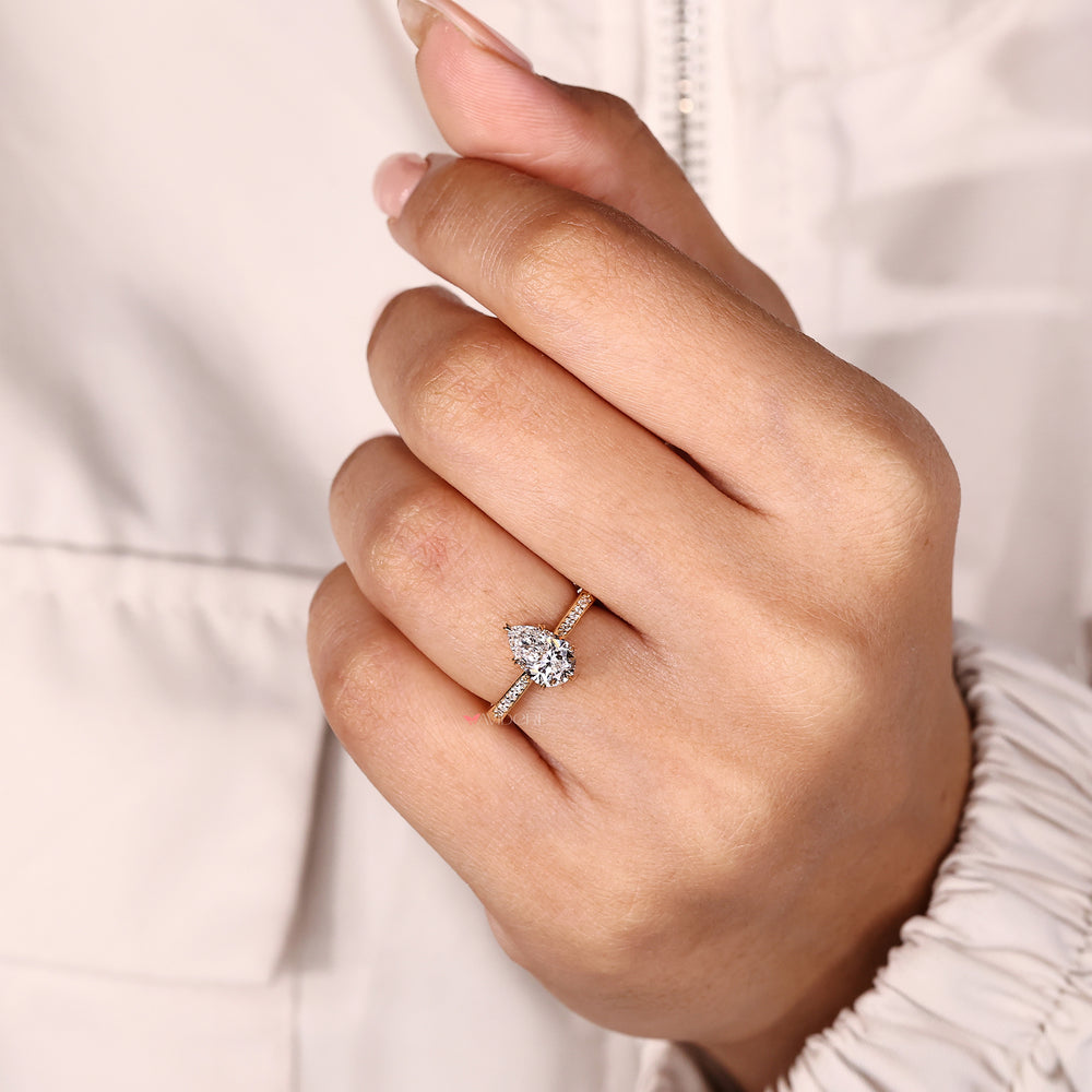 Lab grown pear diamond ring with cathedral setting.
