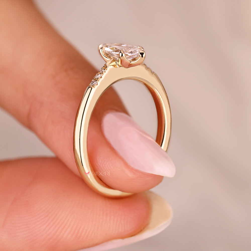 Lab grown marquise diamond ring with tapered shank.
