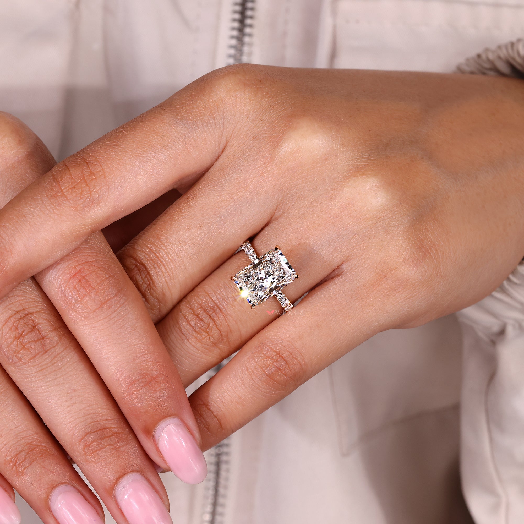 Handmade hidden halo radiant cut diamond ring.
