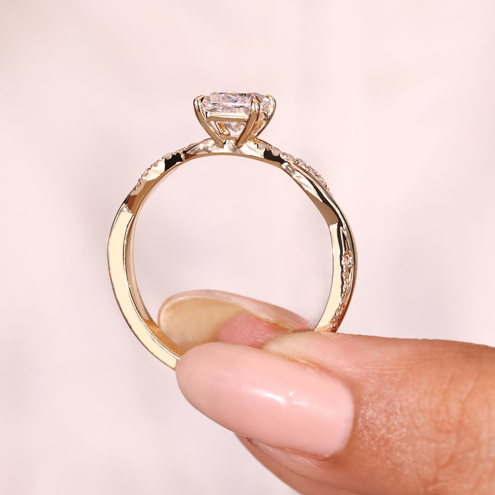Handmade princess cut engagement ring with claw prongs
