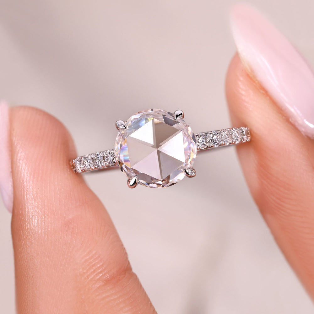 Round rose cut diamond ring with refined prong setting.
