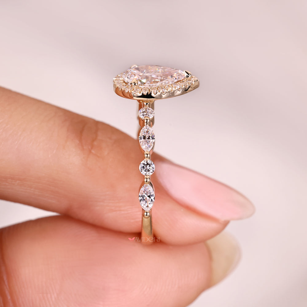 Lab grown pear diamond halo ring.

