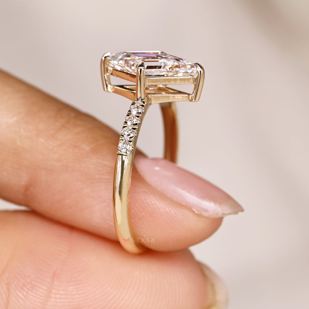 Lozenge ring with round diamond pave design.
