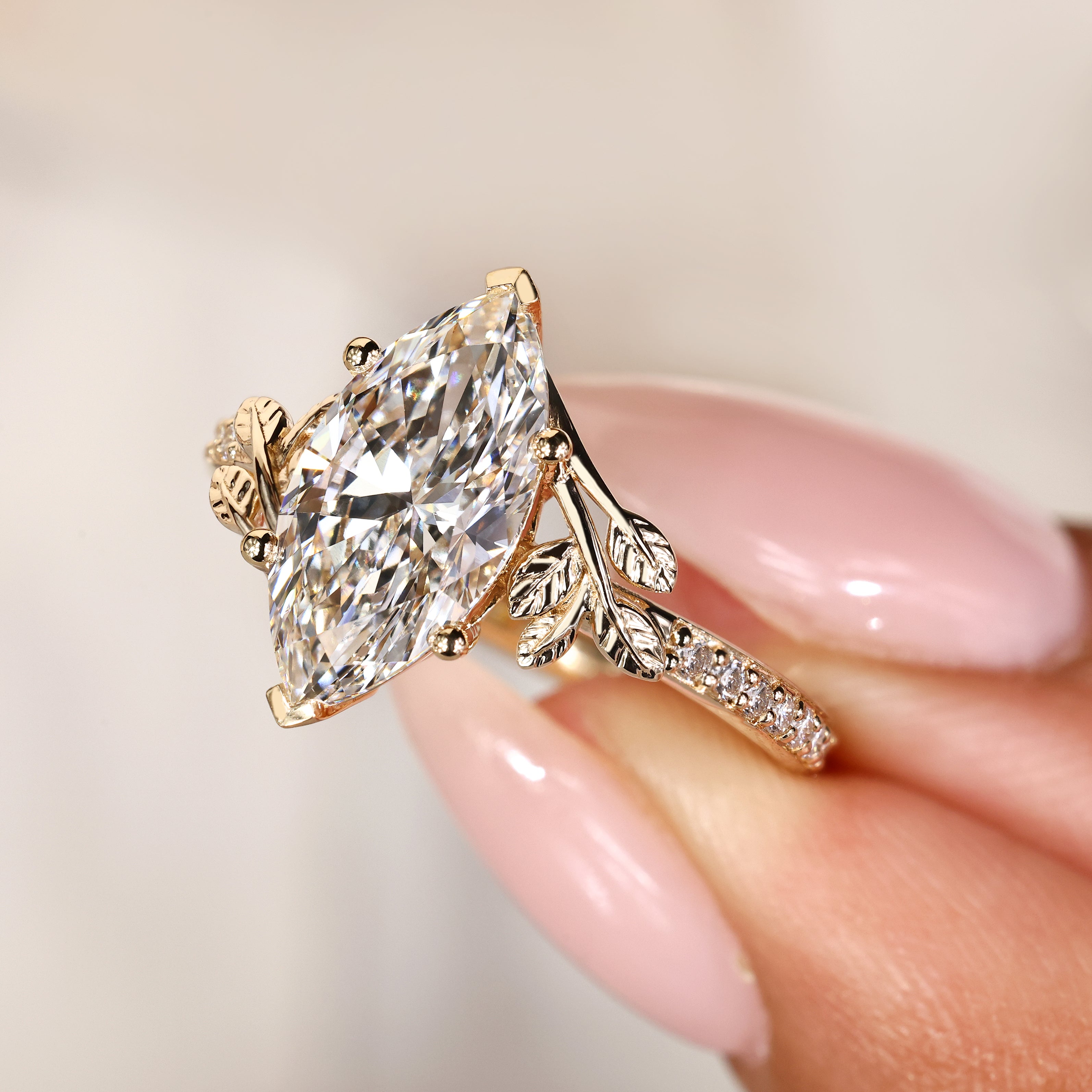 Marquise diamond ring with basket setting and V prongs

