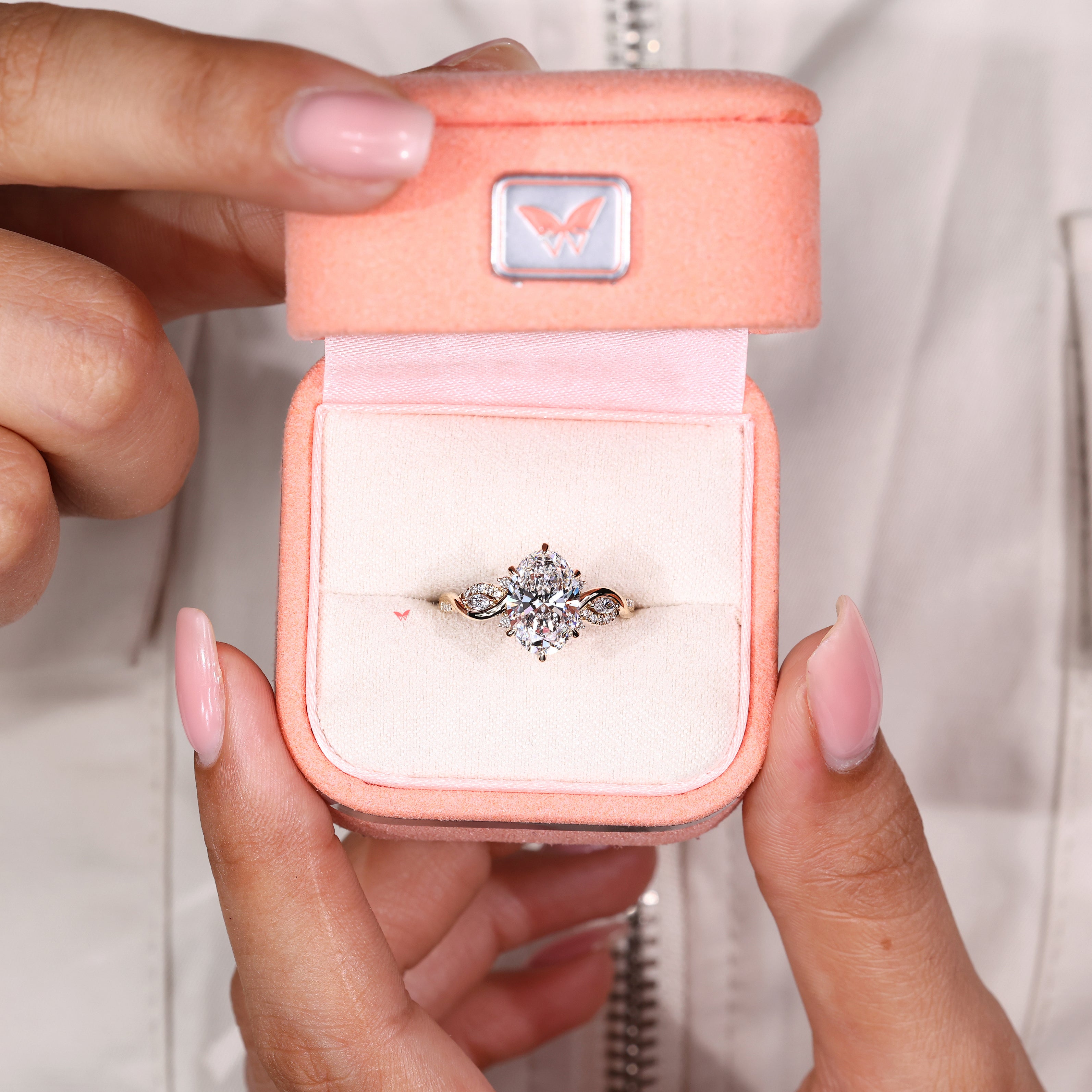 Handmade oval engagement ring with twisted shank and accents
