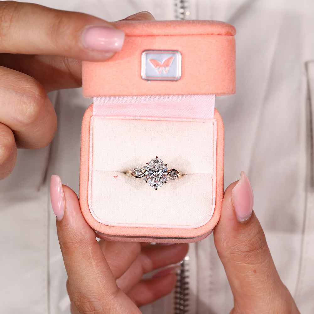 Handmade oval engagement ring with twisted shank and accents
