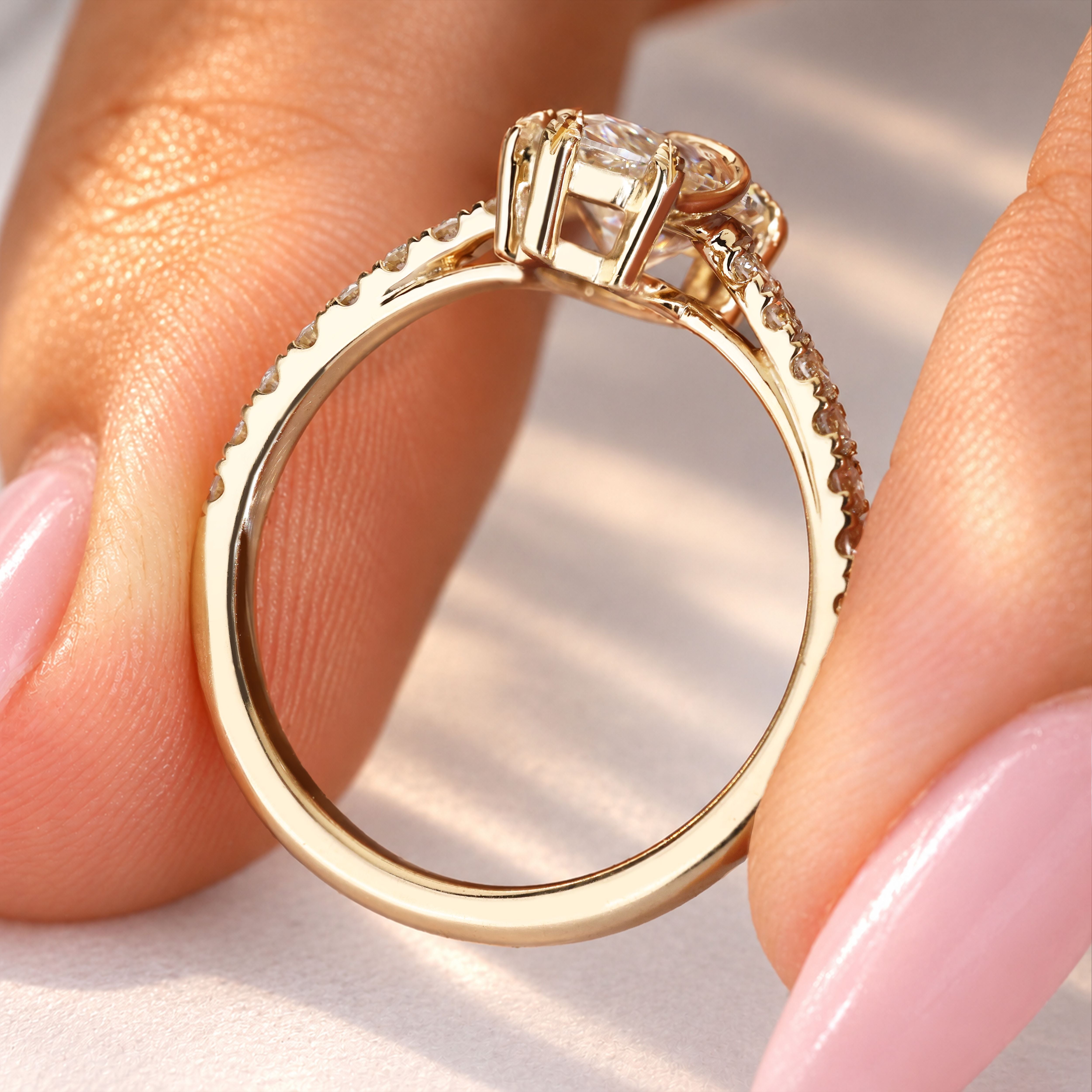 Marquise diamond ring with leaf style prongs.
