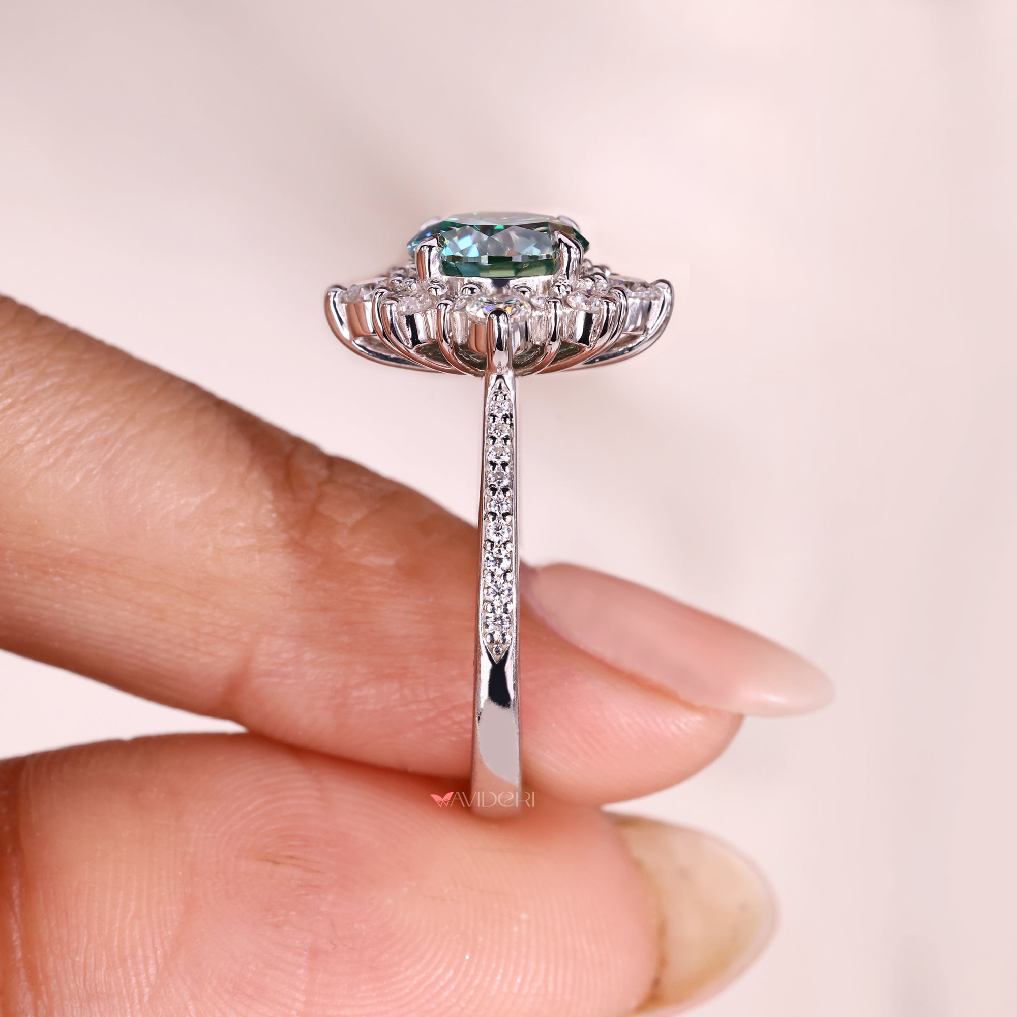 Round moissanite ring with cluster style design.
