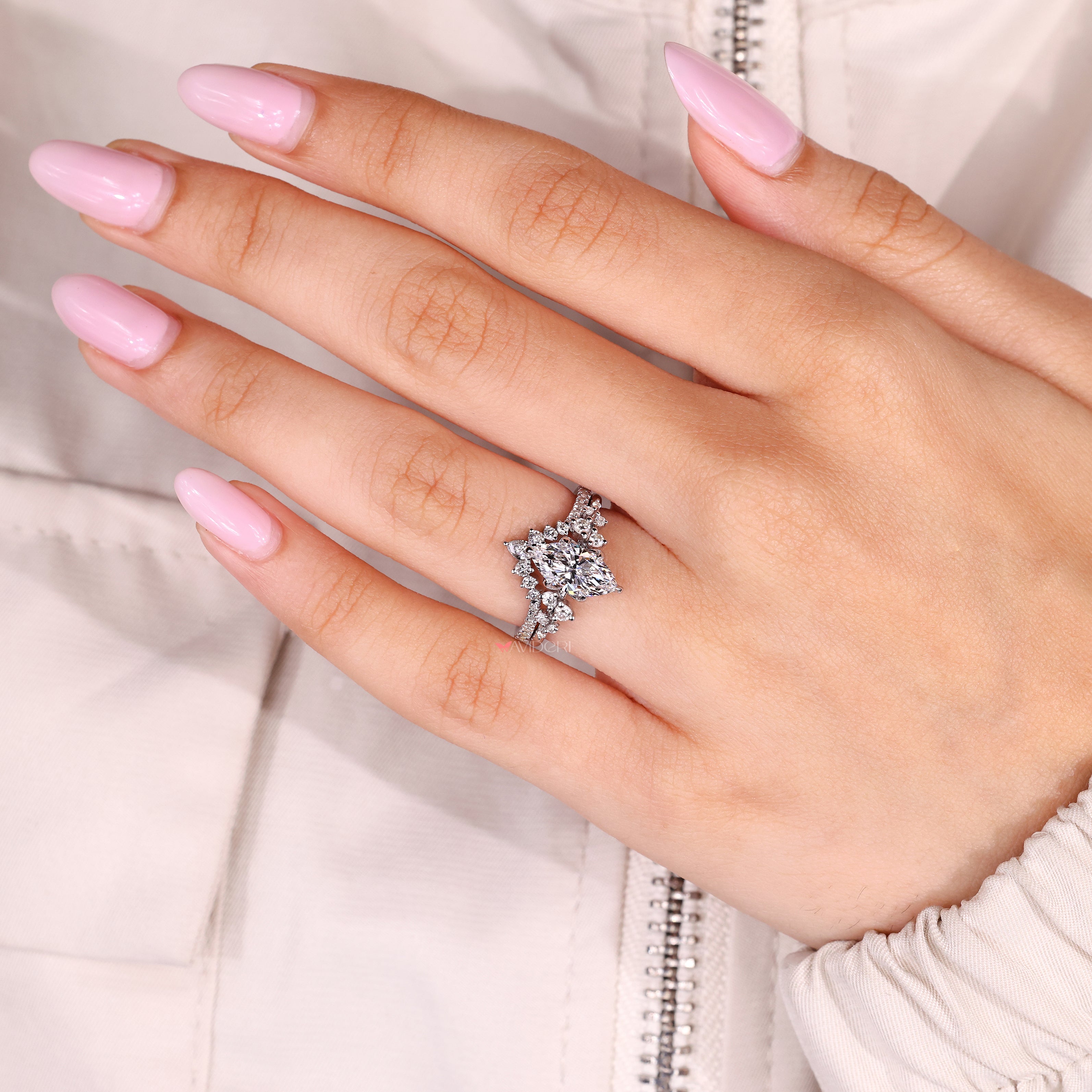Marquise diamond ring with tulip setting and claw prongs
