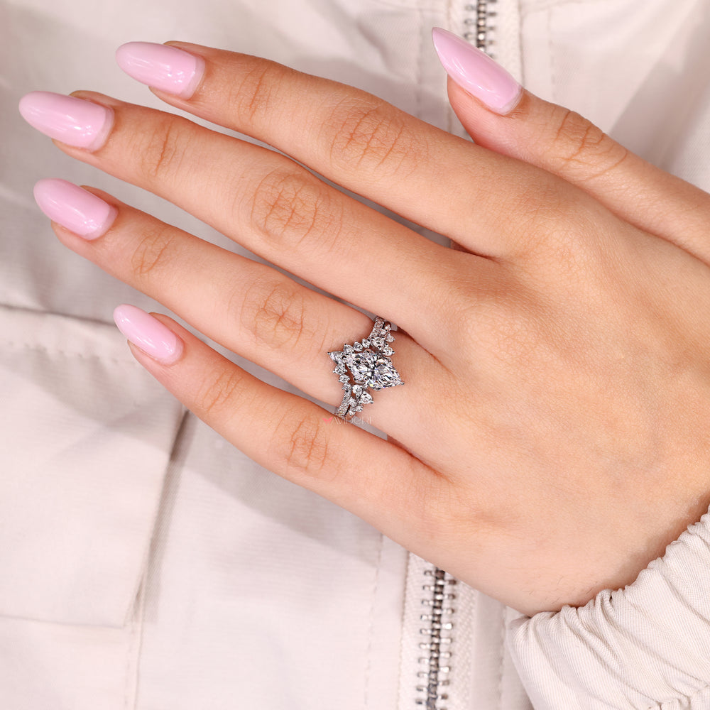Marquise diamond ring with tulip setting and claw prongs
