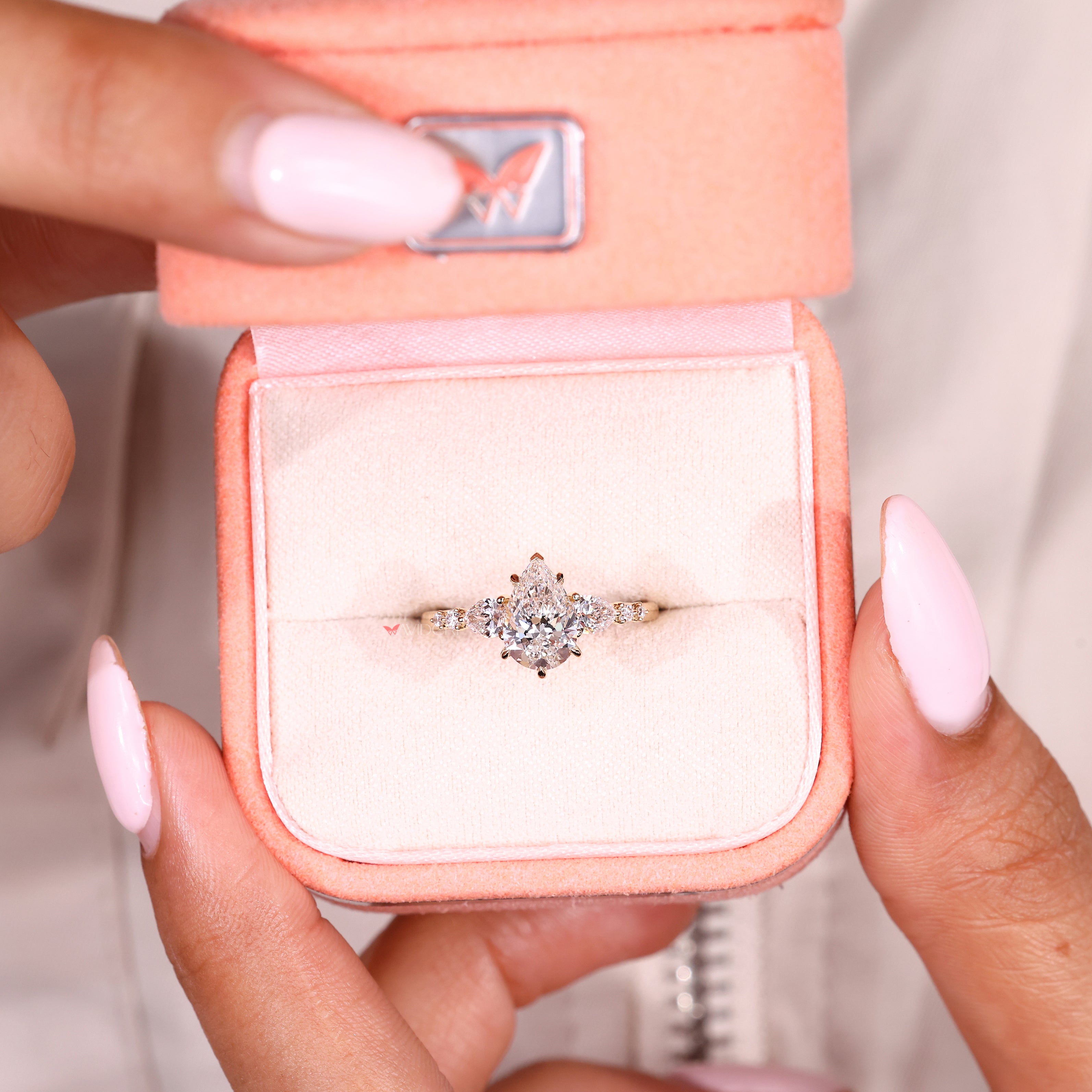 Pear cut diamond ring with V shape and claw prongs
