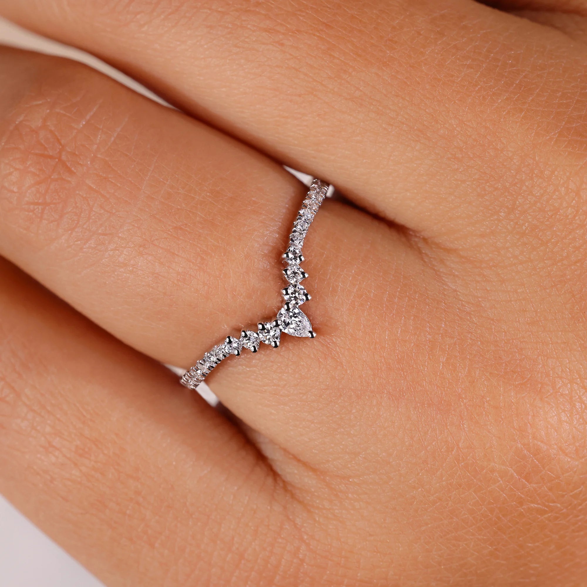 Chevron wedding band with pear cut diamond band.
