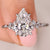 Pear cut diamond engagement ring with muse setting.