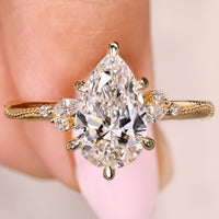 Pear Cut Diamond Ring With Side Stone In Vintage Style