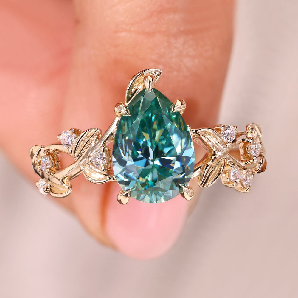 Pear cut engagement ring with nature inspired engagement ring.