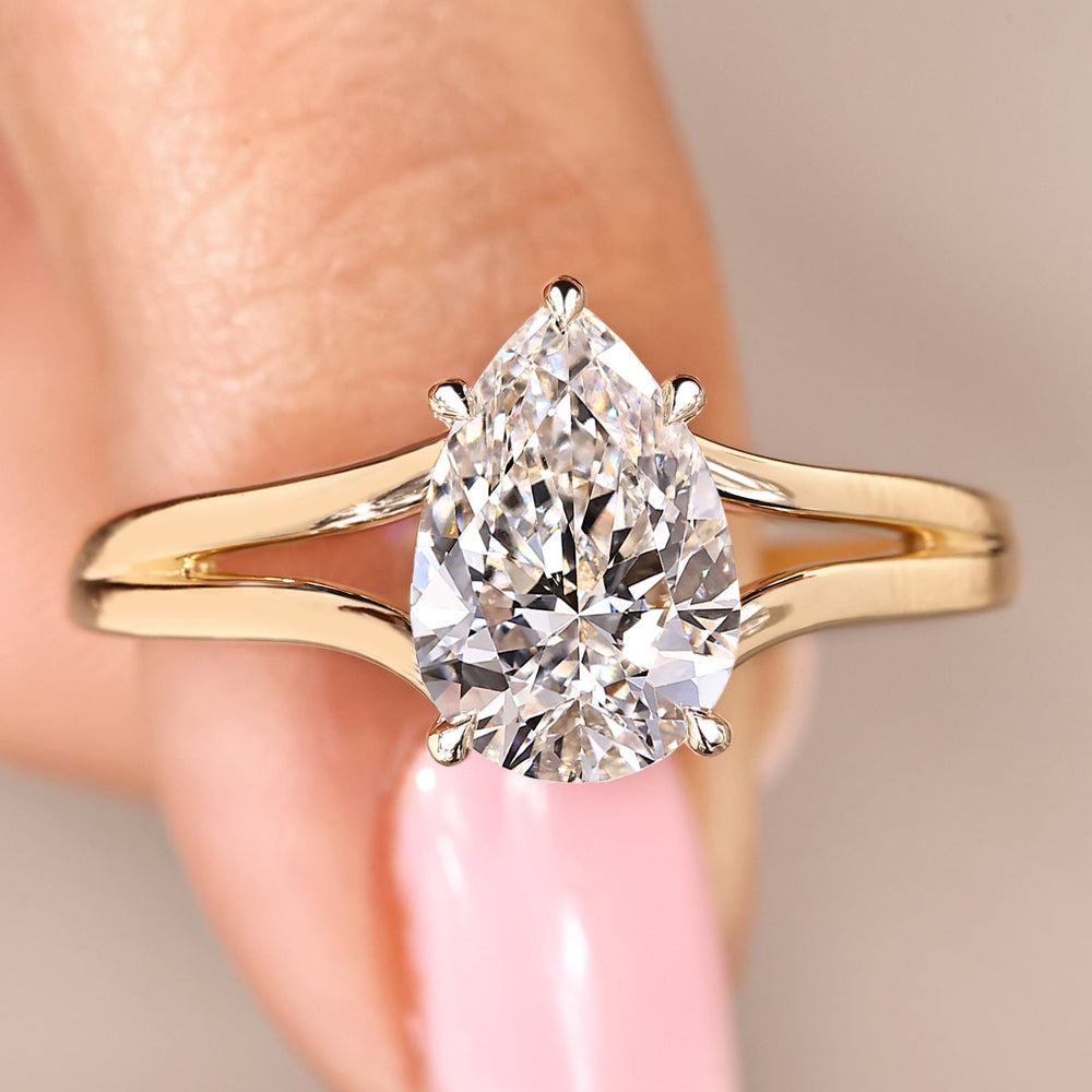 Pear cut lab grown diamond ring in solitaire setting with hidden halo