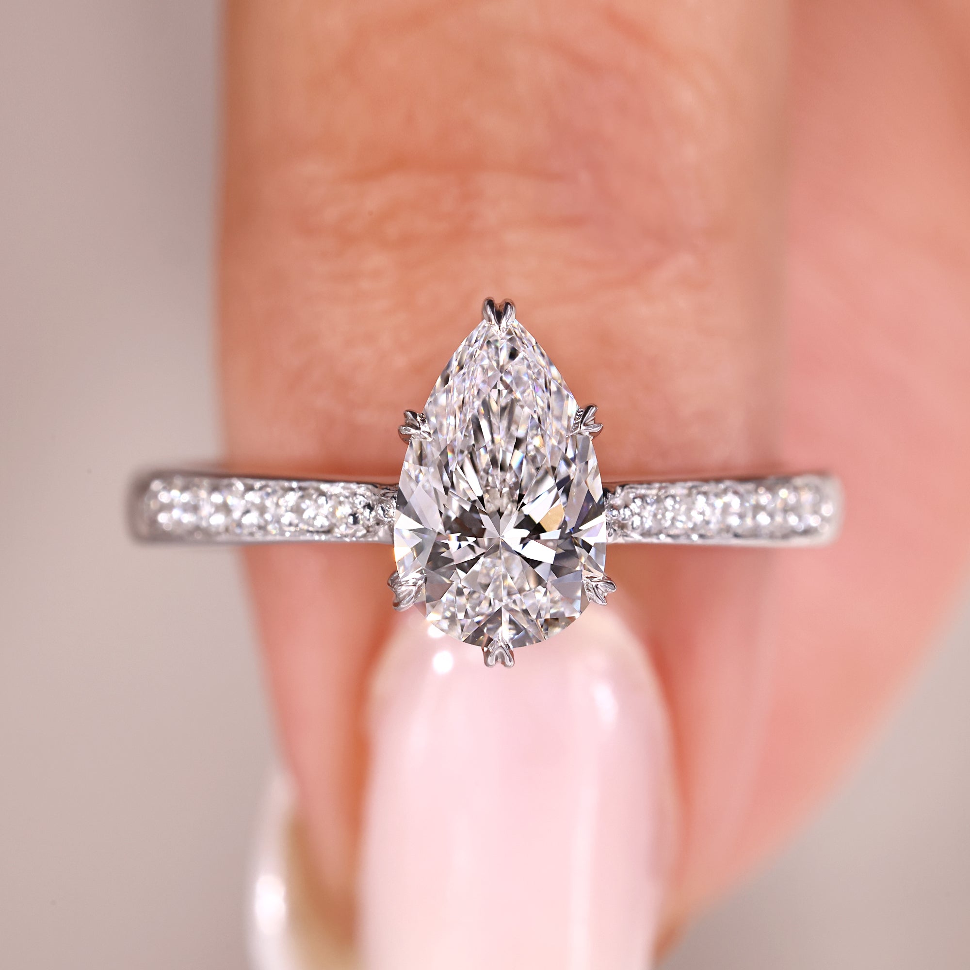 Elegant anniversary ring with pear cut diamond.