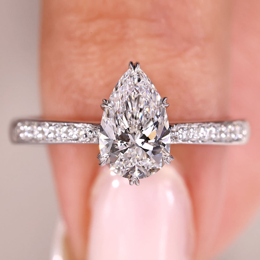Elegant anniversary ring with pear cut diamond.