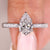 Elegant anniversary ring with pear cut diamond.