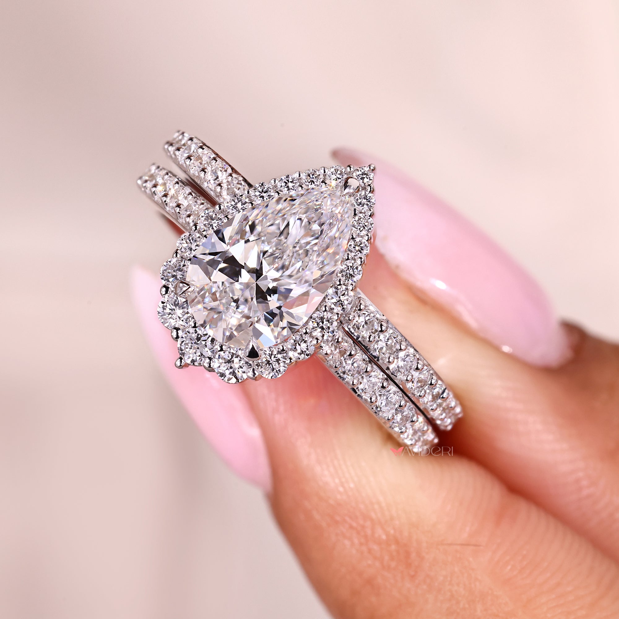 Custom bridal set with pear and round diamonds.