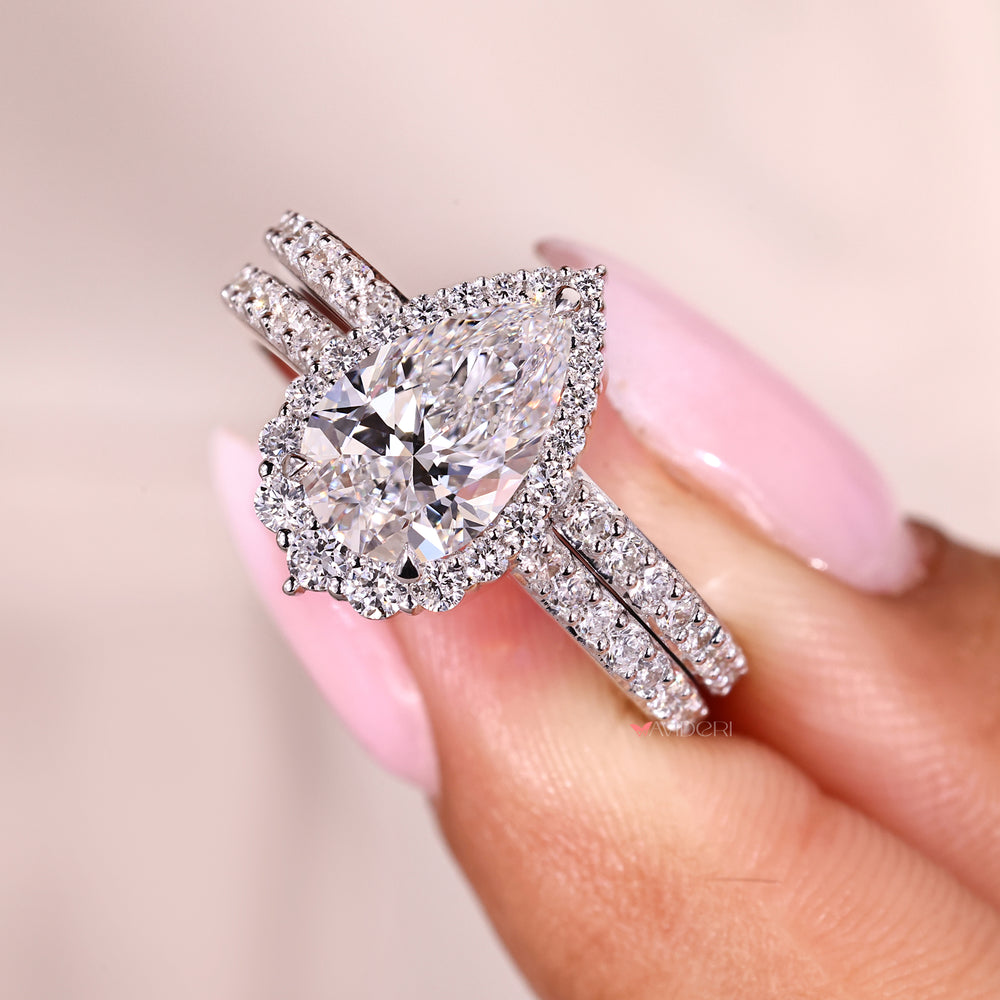 Custom bridal set with pear and round diamonds.