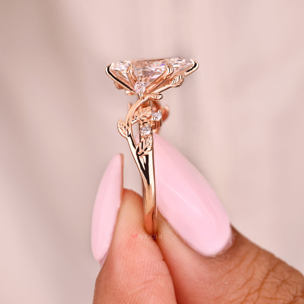 IGI certified pear diamond ring with nature inspired details
