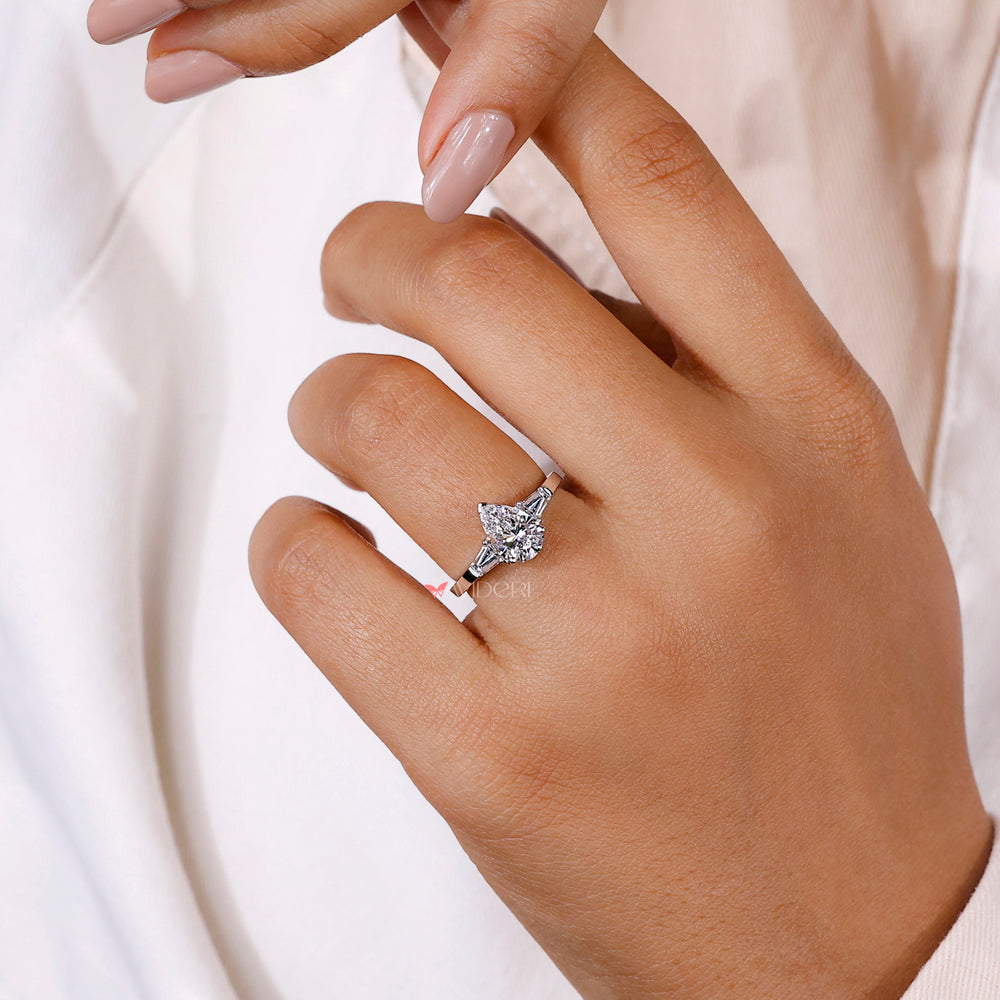 V Prong engagement ring with a pear-shaped diamond for a secure, elegant, and timeless design.
