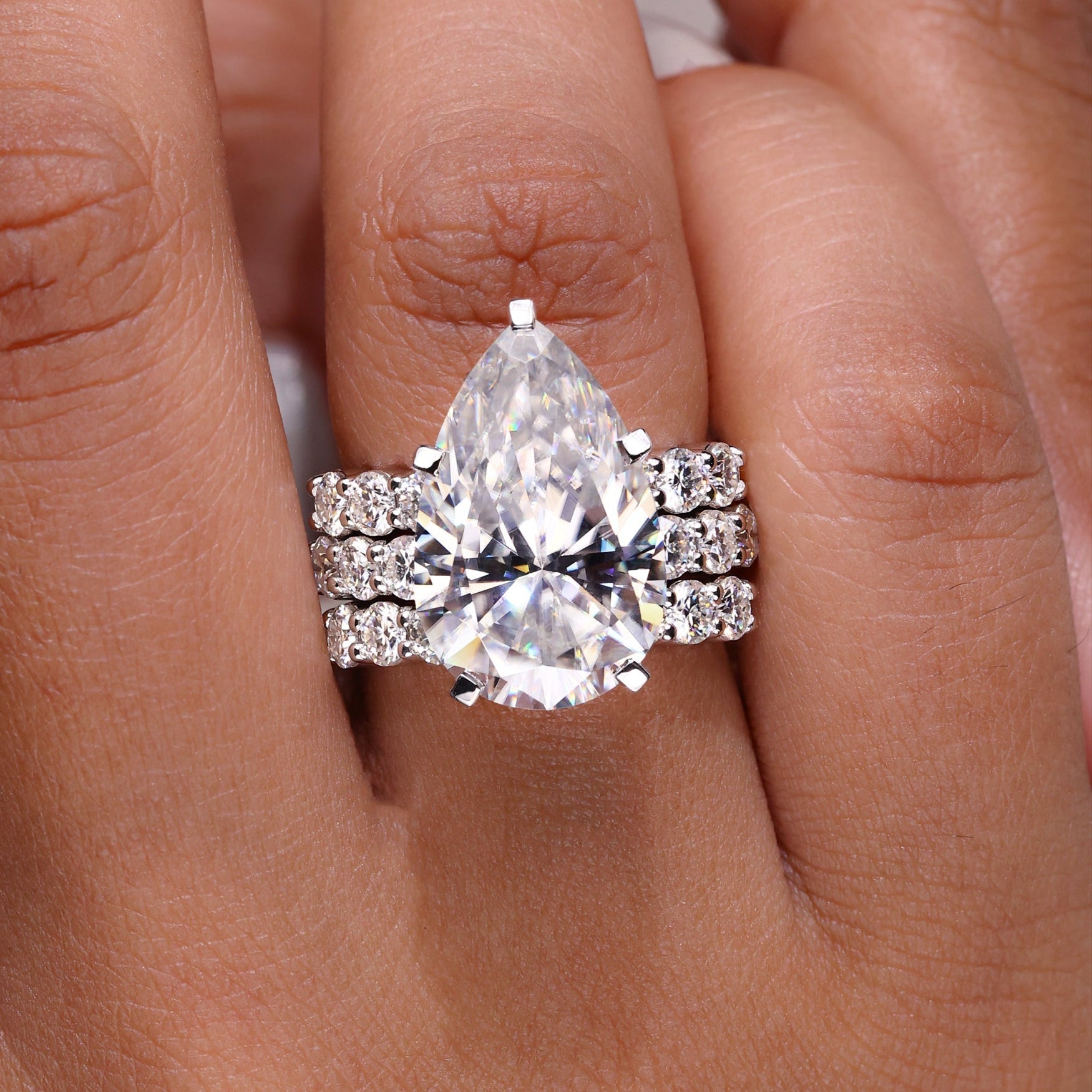 Pear Engagement Ring with Wedding Band featuring Hidden Halo Setting.