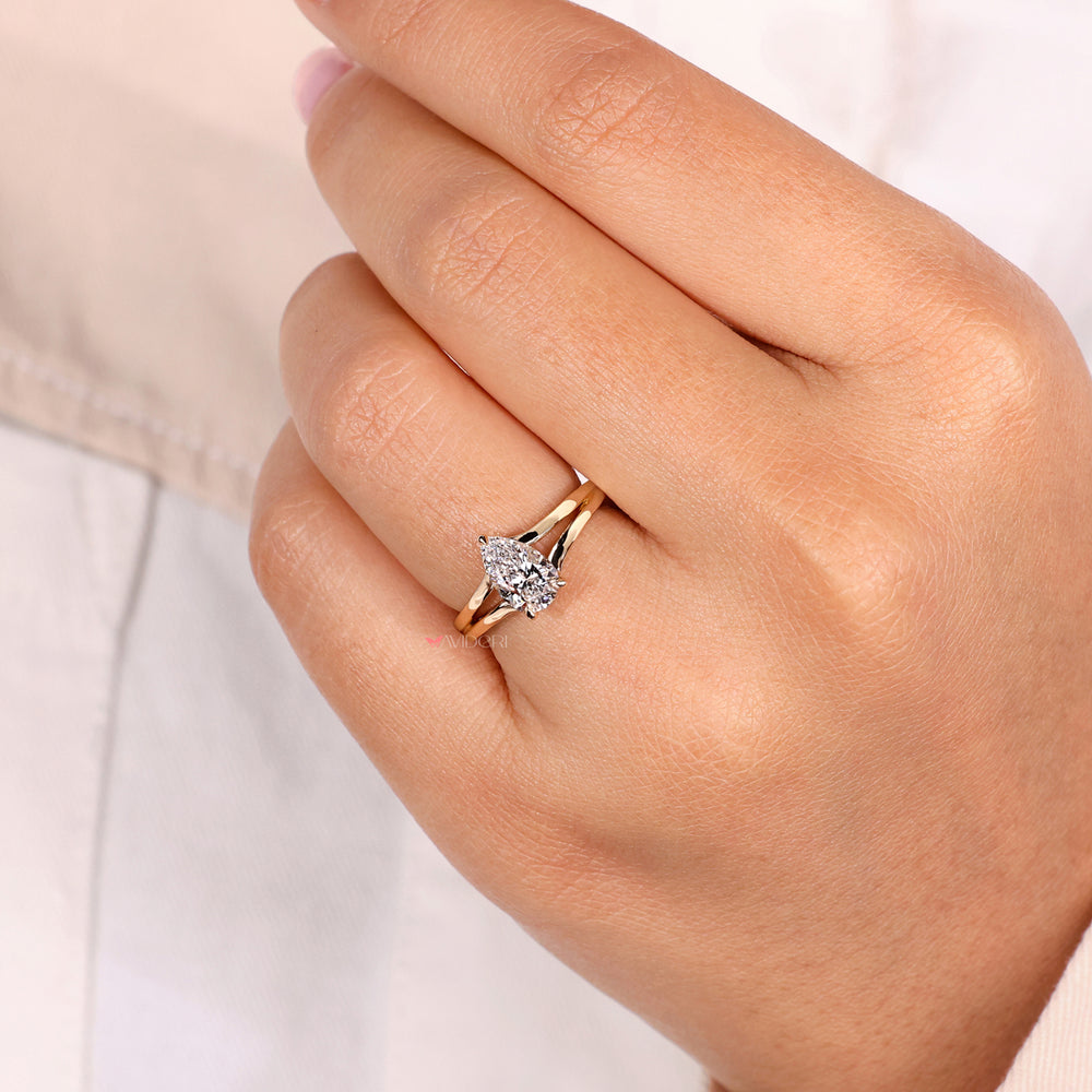 Pear cut diamond ring featuring a split shank engagement ring design, handmade with exceptional attention to detail.
