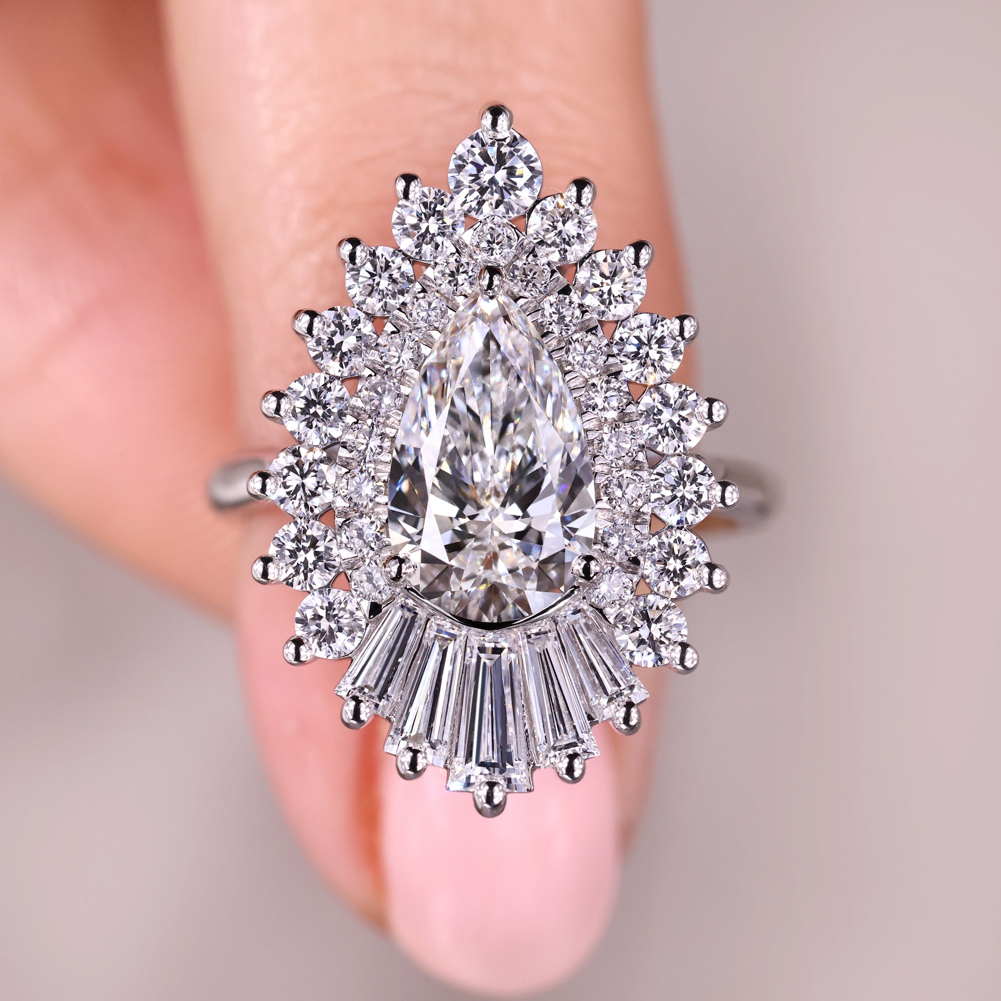 Pear shape diamond ring with double halo ring.