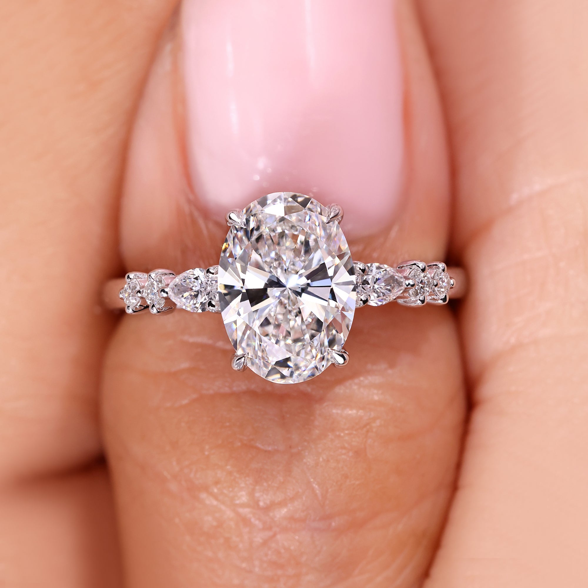 Avideri Seven Stone Diamond Ring with Oval Center.