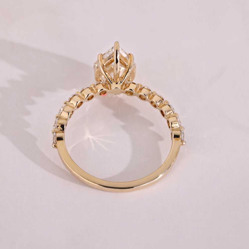 Yellow gold diamond engagement ring with lab grown stone.