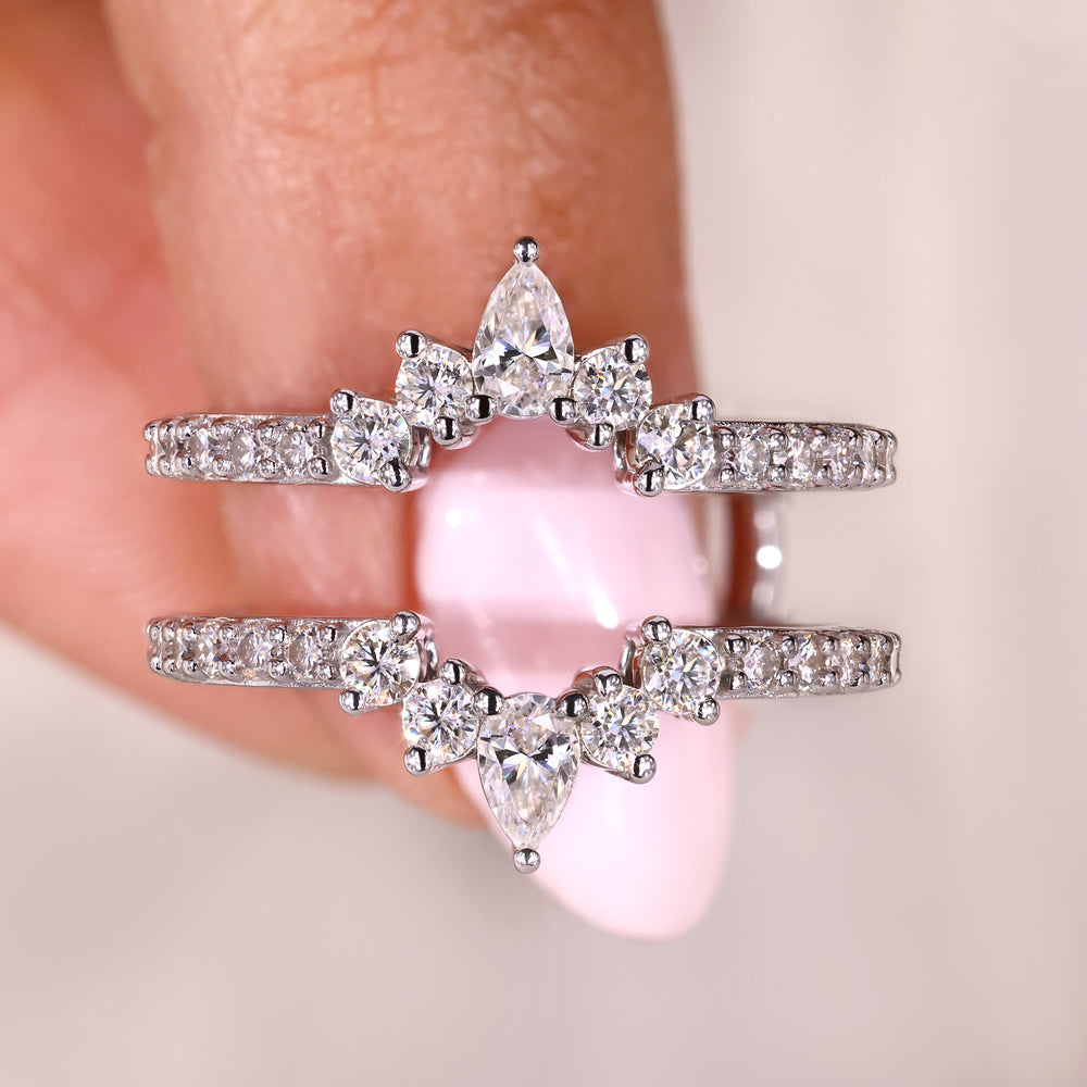 This pear moissanite wedding band has a unique, elegant design.
