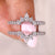 This pear moissanite wedding band has a unique, elegant design.
